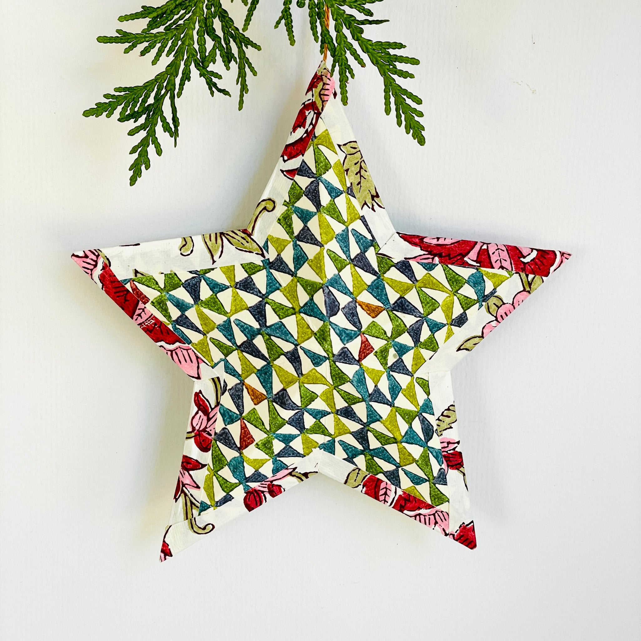 Hanging star in pink Venetian in multi-geometric/christmas red floral